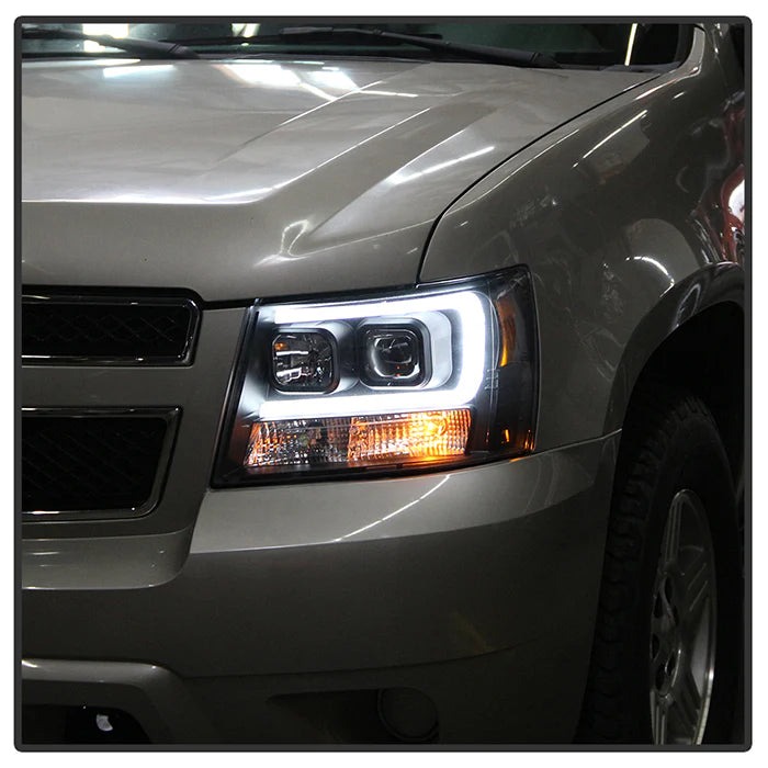 2007-2014 Chevy Suburban 1500/2500 / 2007-2014 Chevy Tahoe / 2007-2014 Avalanche Version 2 Projector Headlights - High H1 (Included) - Low H7 (Included) Light Bar DRL - Black