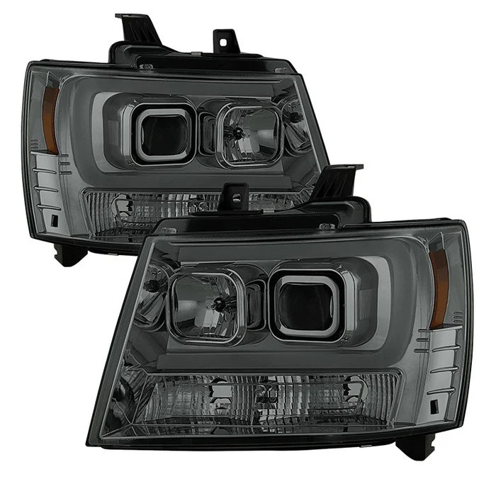 2007-2014 Chevy Suburban 1500/2500 / 2007-2014 Chevy Tahoe / 2007-2014 Avalanche Version 2 Projector Headlights - High H1 (Included) - Low H7 (Included) Light Bar DRL - Smoke
