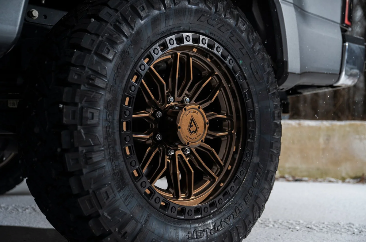 20x9.0 Arena Hustle Smoked Bronze Center Satin Black Lip