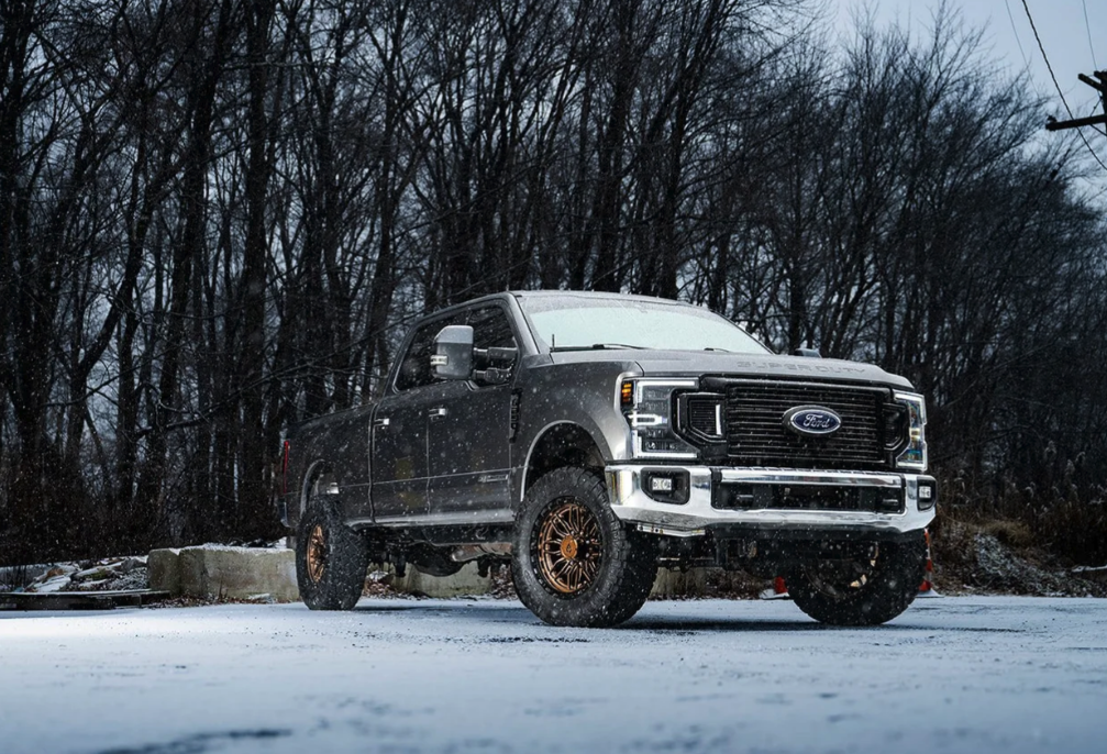 20x9.0 Arena Hustle Smoked Bronze Center Satin Black Lip