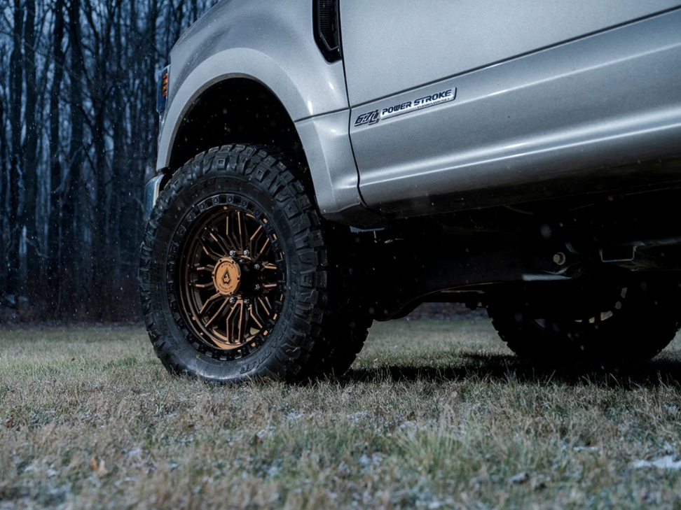 20x9.0 Arena Hustle Smoked Bronze Center Satin Black Lip