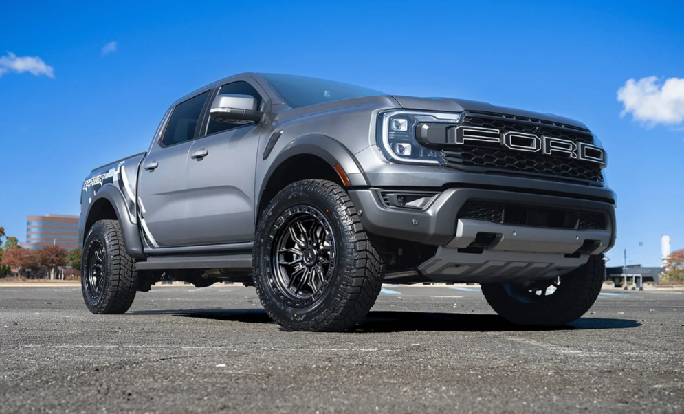 20x9.0 Arena Hustle Smoked Bronze Center Satin Black Lip